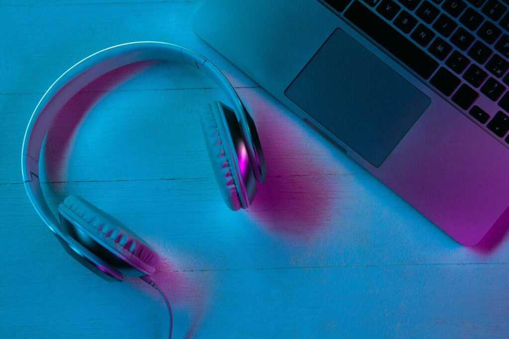 Top view of set of gadgets in purple neon light and blue
