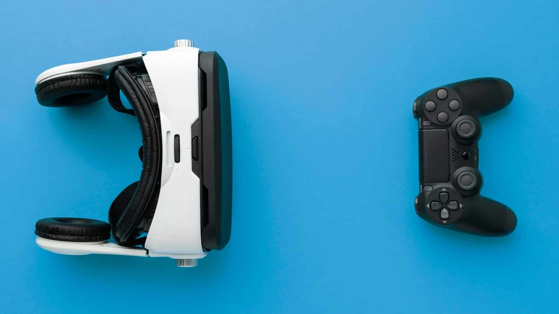 A PlayStation VR headset and a black DualShock controller on a blue background.